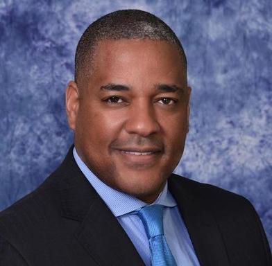 Calvin A Moore Headshot blue bckgrd.jpg